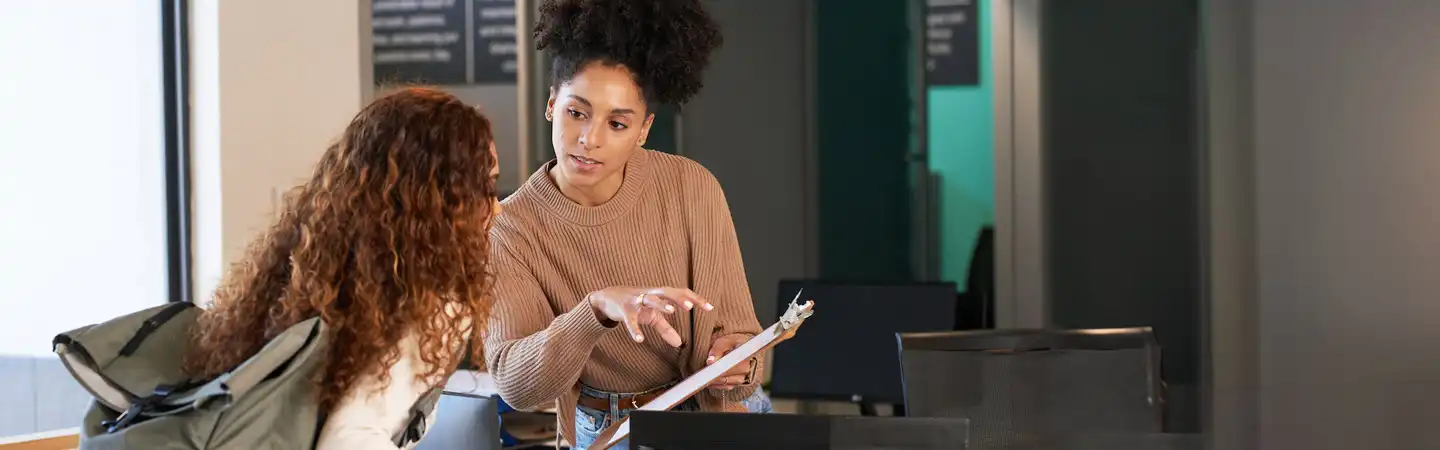 woman offering a young female student support