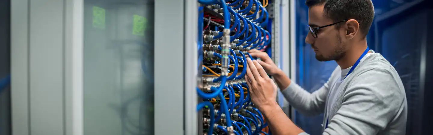A person working on technology.